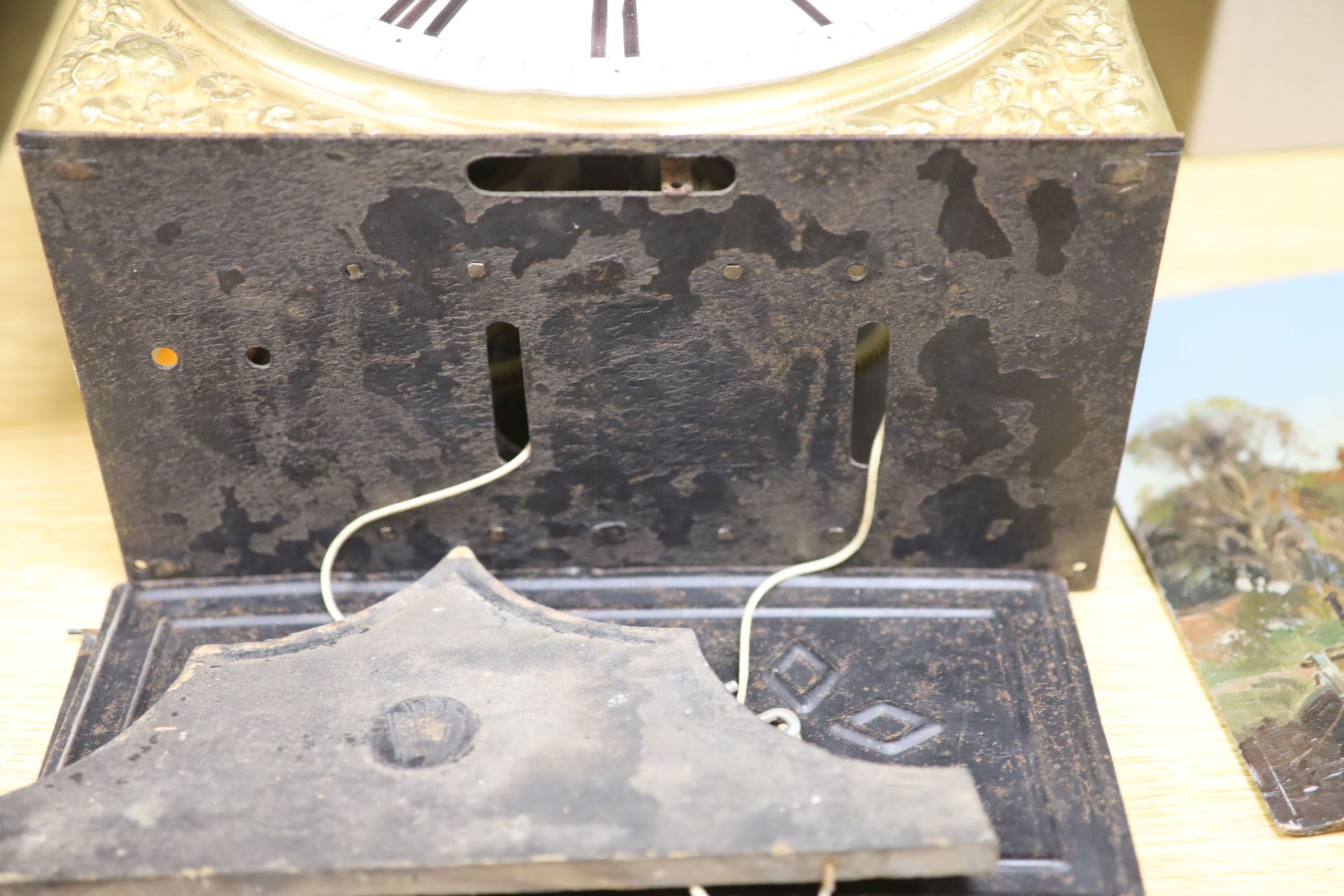 A 19th century French embossed brass wall clock, height 42cm